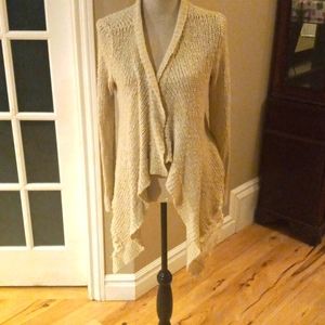Cream colored,long sleeved shrug.